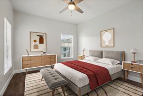 Lakeland apartment for rent - A bedroom with a bed, nightstand, and chair.
